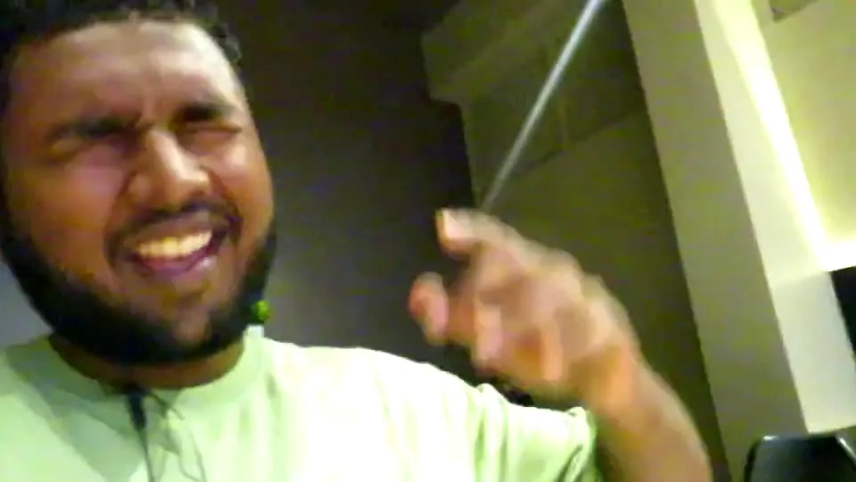 A close handheld frame from an indoor talking clip.